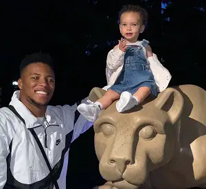 Saquon Barkley with his daughter