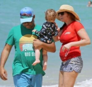 Chelsea Peretti with her husband & son