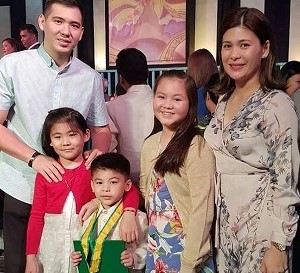 Roxanne Guinoo with her husband & kids
