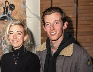 Callum Turner with his girlfriend