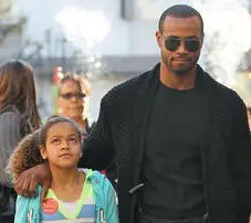 Isaiah Mustafa with his daughter
